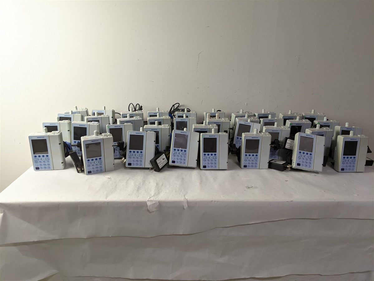Baxter Sigma Spectrum Infusion Pump | Lot of 27 | Pole Clamps and AC Adapters