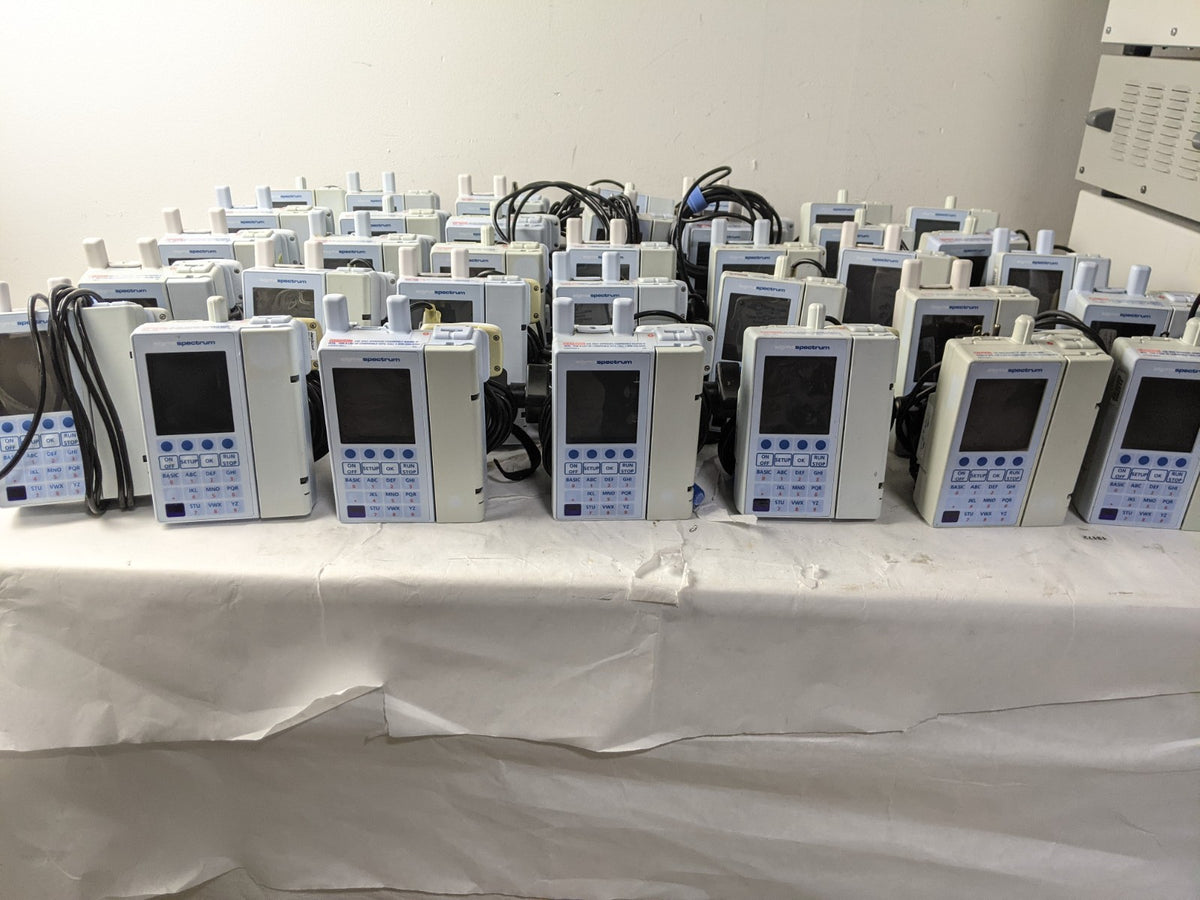 Lot of 40 Baxter Sigma Spectrum Infusion Pump w/ AC Adapter and Pole Clamp