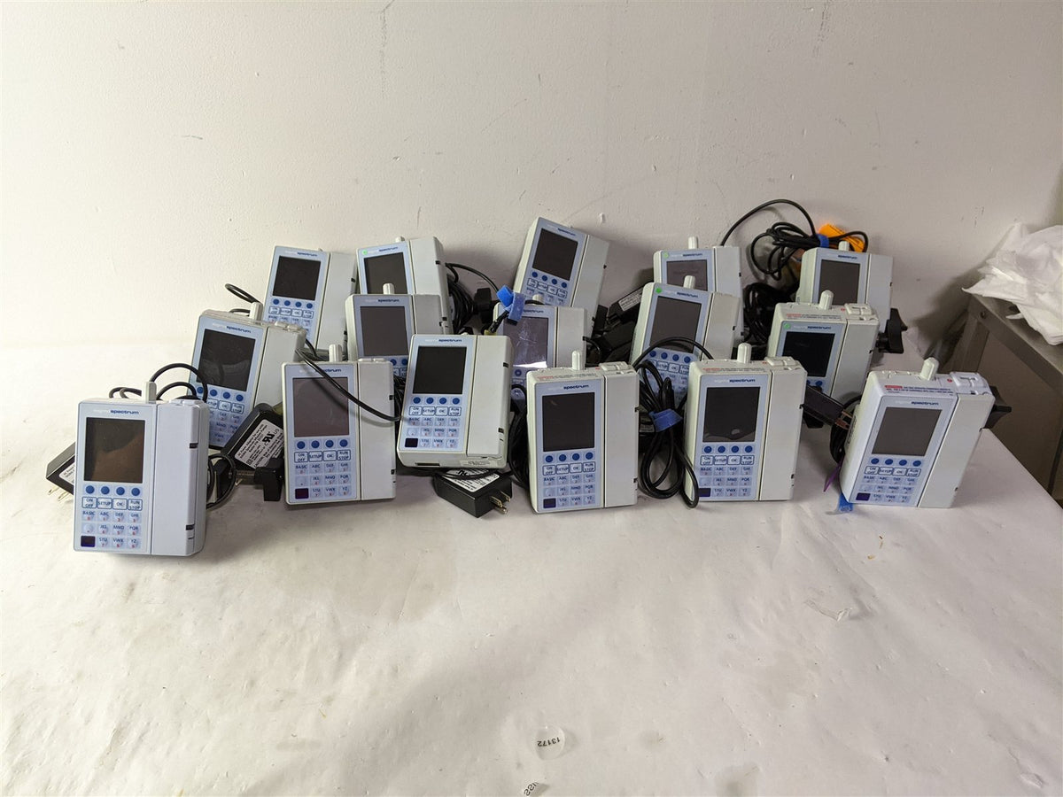 Baxter Sigma Spectrum Infusion Pump | Lot of 27 | Pole Clamps and AC Adapters