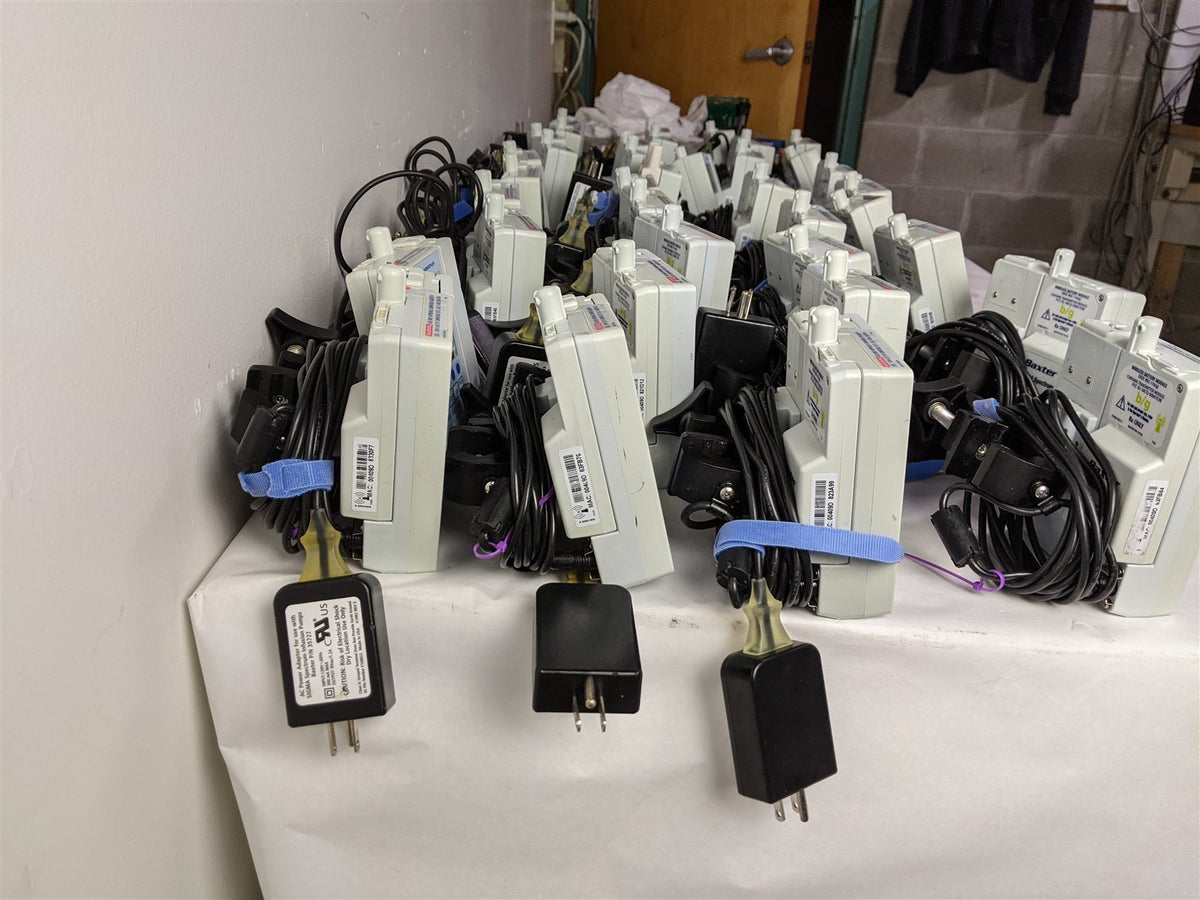 Baxter Sigma Spectrum Infusion Pump | Lot of 27 | Pole Clamps and AC Adapters
