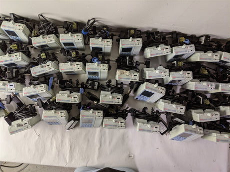 Baxter Sigma Spectrum Infusion Pump | Lot of 27 | Pole Clamps and AC Adapters